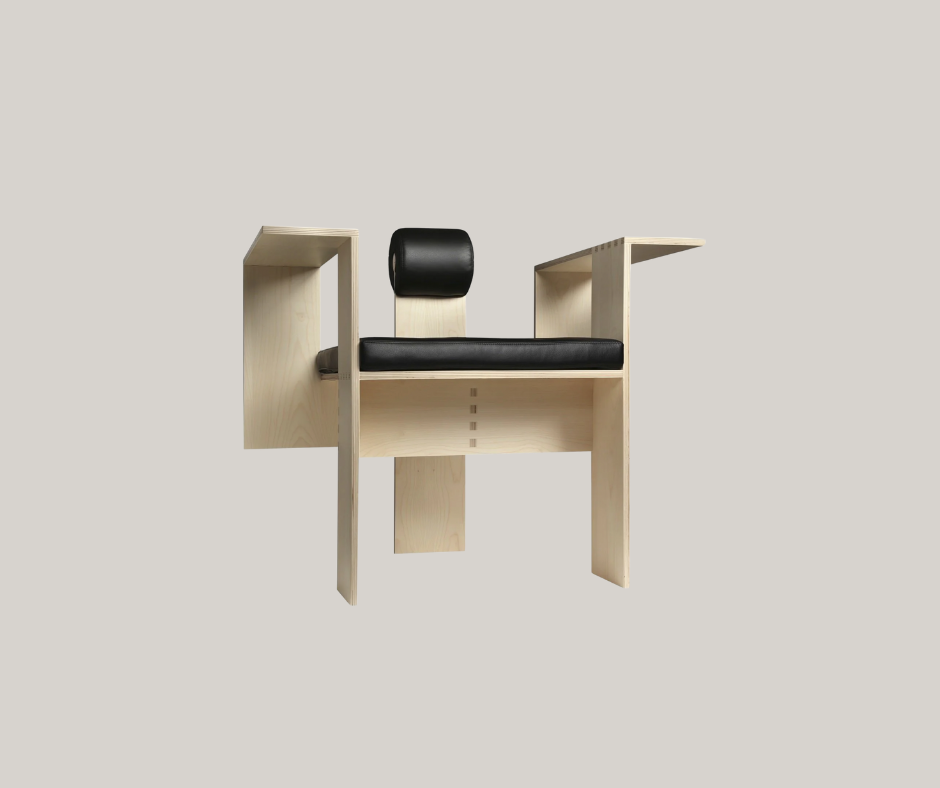 We love this bleached wood and black leather chair; it almost looks like a dentist's chair but it is certainly unique