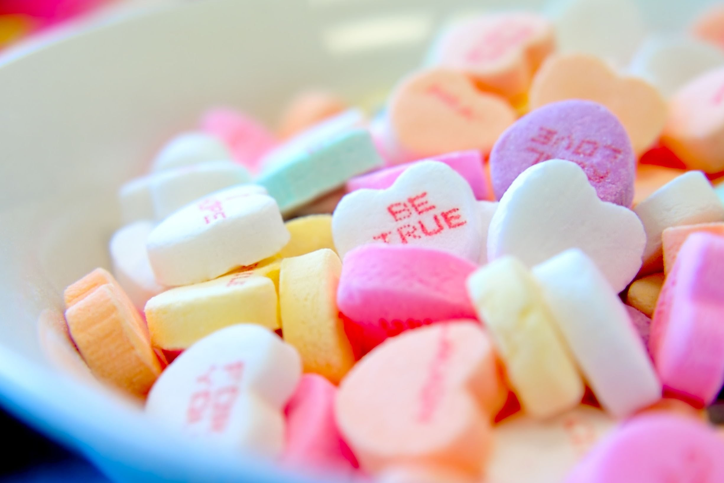 A bowl of heart candies.