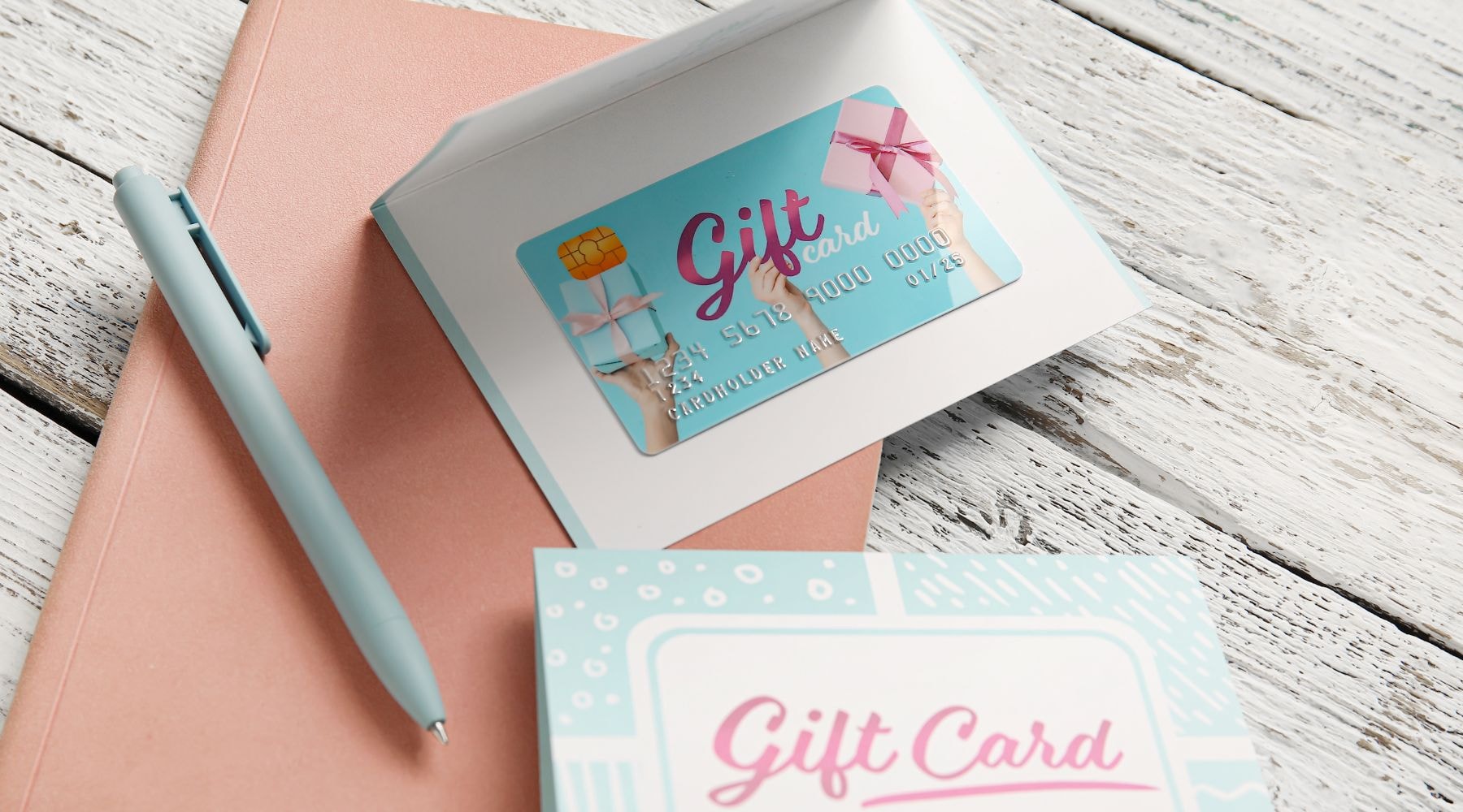 Gift card on a pink notebook, symbolizing thoughtful gifting options.