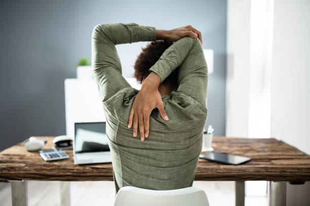 Woman stretching core muscles at work