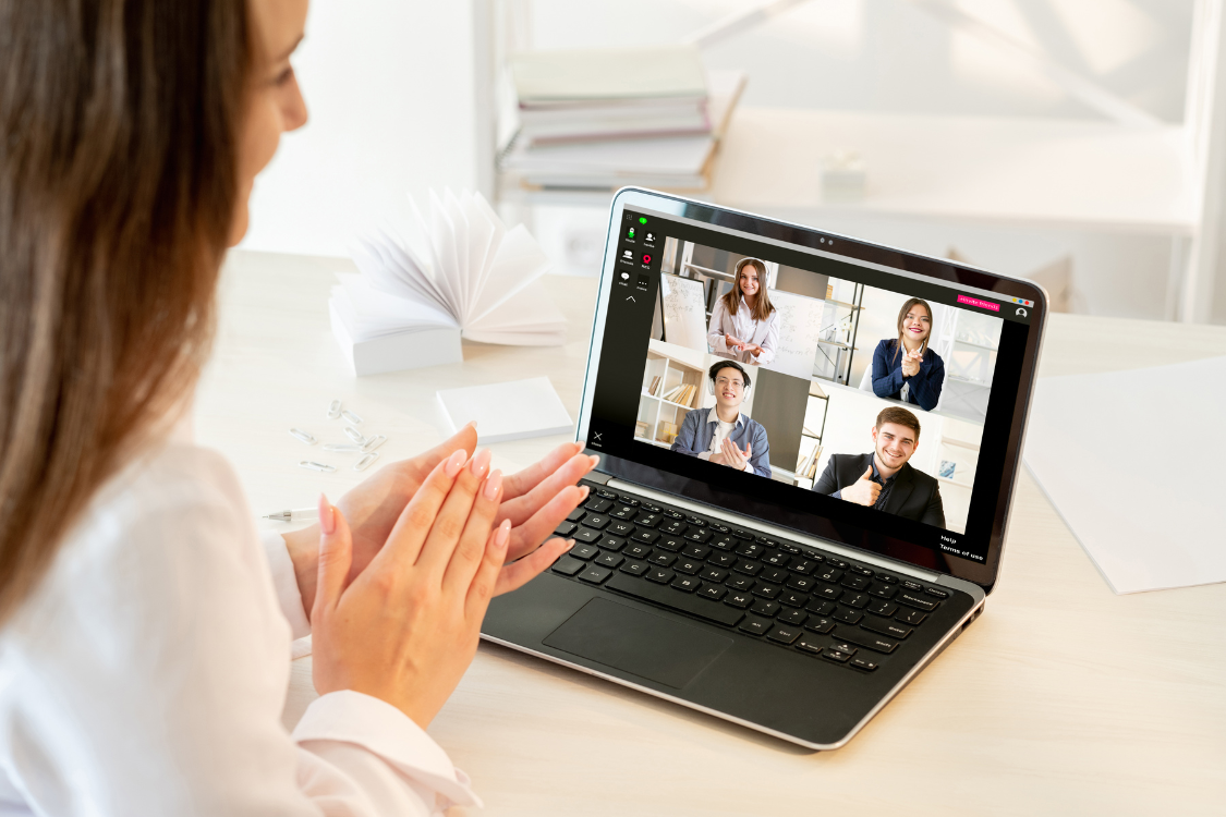 Team members applauding during a virtual meeting to recognize offshore employees for their contributions and performance