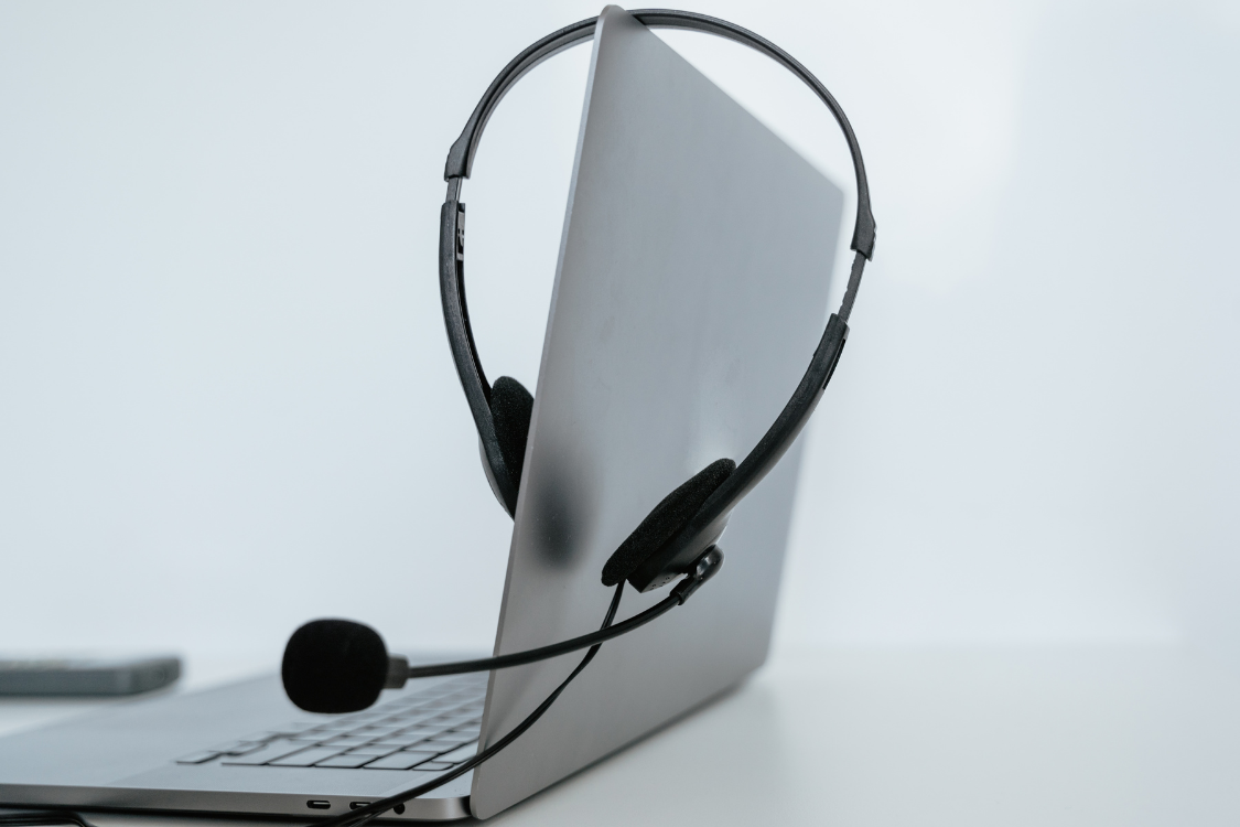  Headset resting on a laptop prepared for a remote skills evaluation