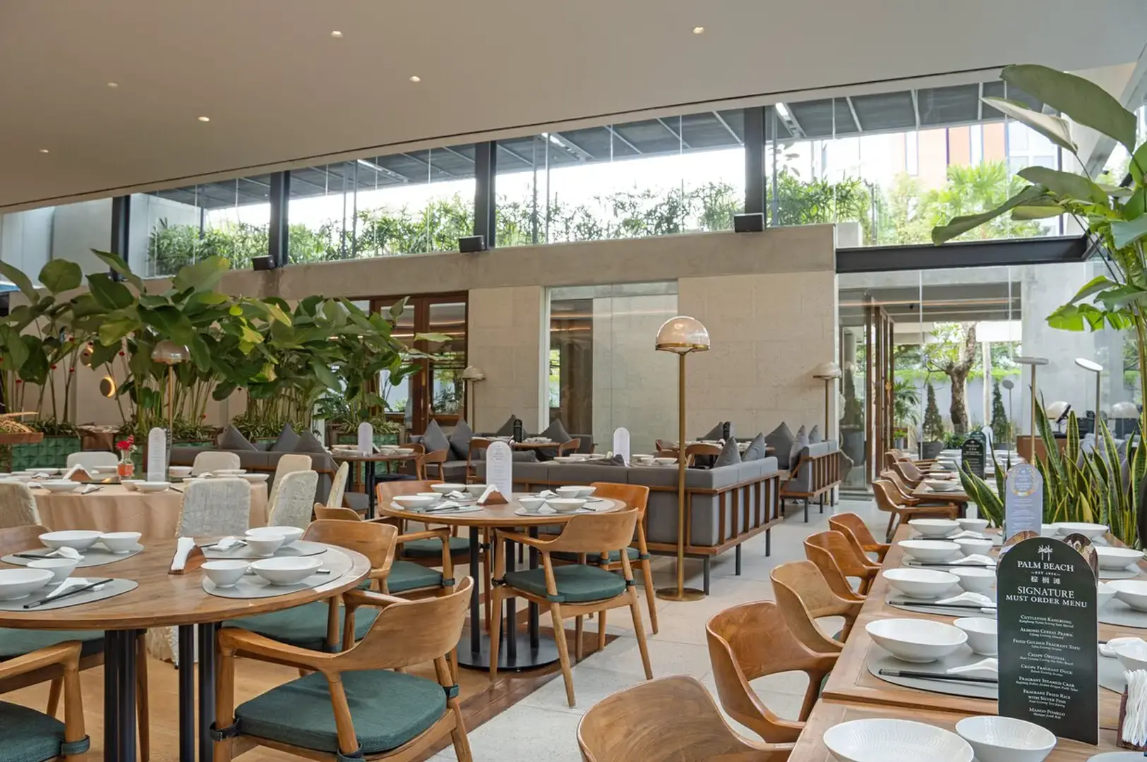 Palm Beach Seafood Restaurant Singapore dining room with elegant tables and tropical interior