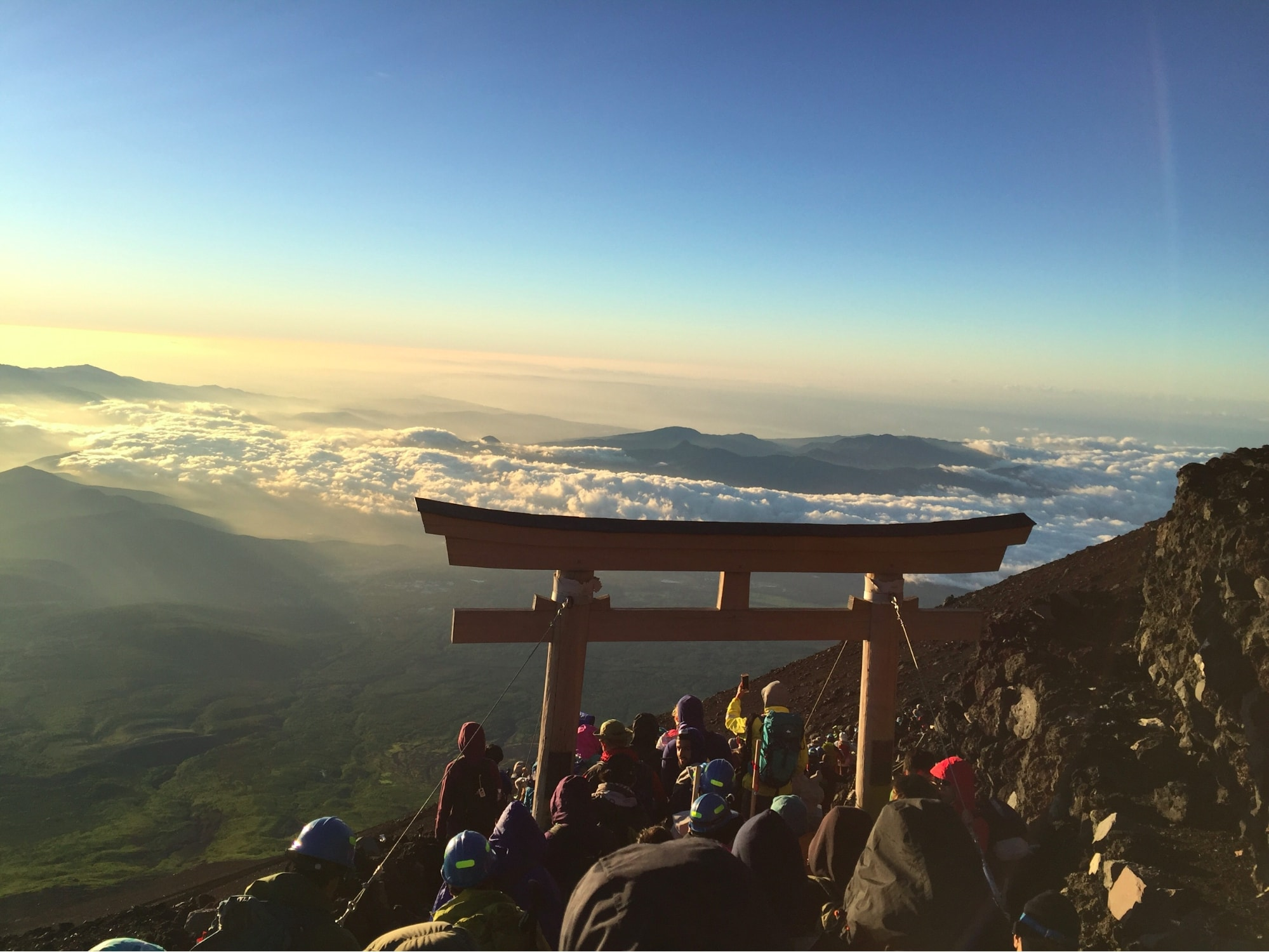 Hikers at Mt. Fuji watching the rising sun