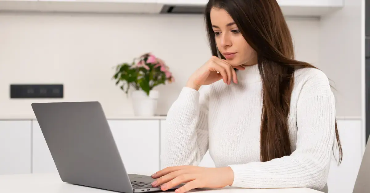 Woman reviewing investment gains and losses to understand what is tax loss harvesting.