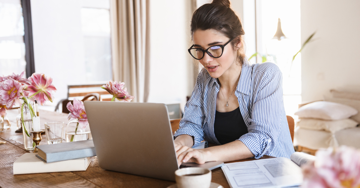 A woman preparing to submit her Google AdSense tax form as a self-employed creator.