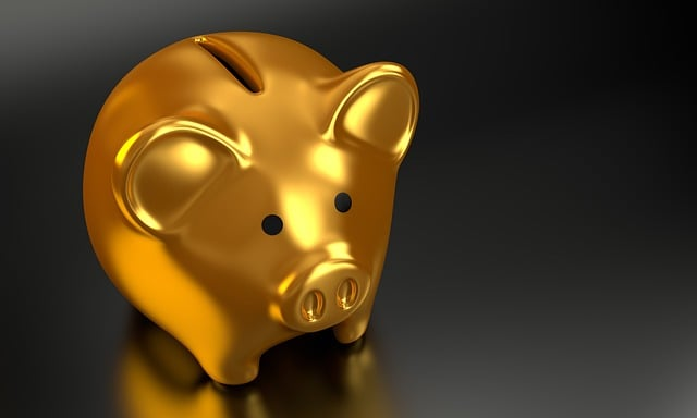 Gold piggy bank with saved money from profit and loss statements