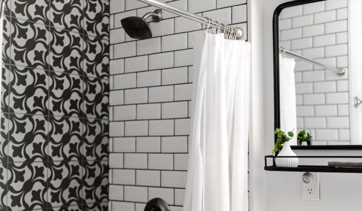 Traditional curtain rod - chrome - white shower curtain - black & white tiled bathroom