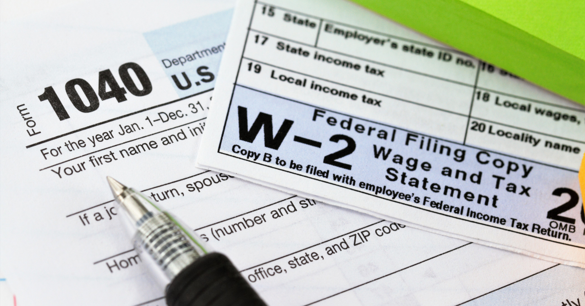 U.S. tax forms 1040 and W-2 representing the difference between SSN and Tax ID for filing taxes as an OnlyFans creator.