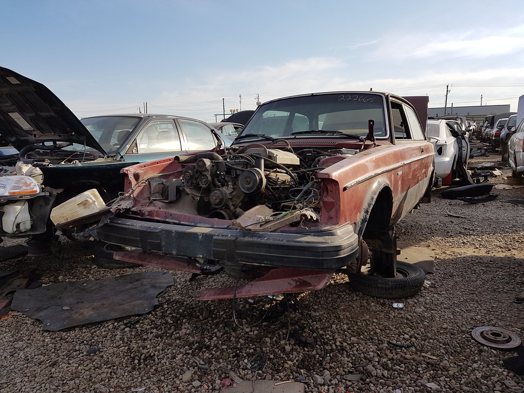 A car with a bad transmission being sold to a junkyard