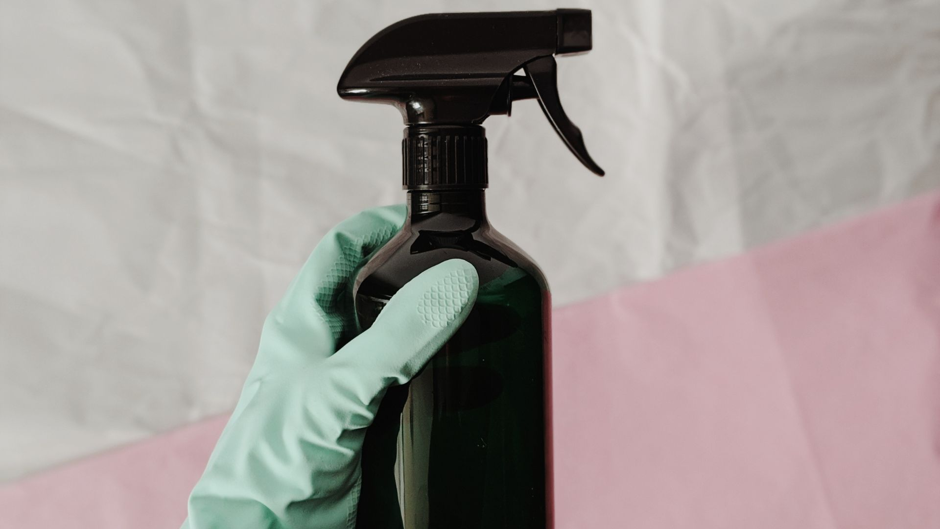 An image of a spray bottle filled with a mixture of essential oils as a natural remedy to prevent flies.