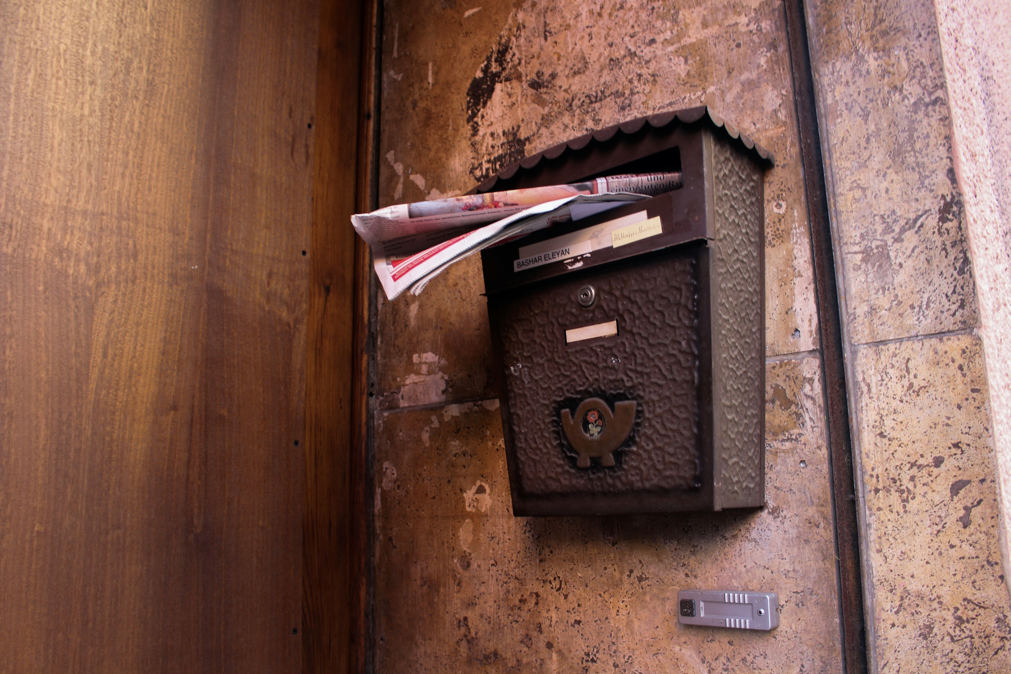 Mailbox filled with mail.