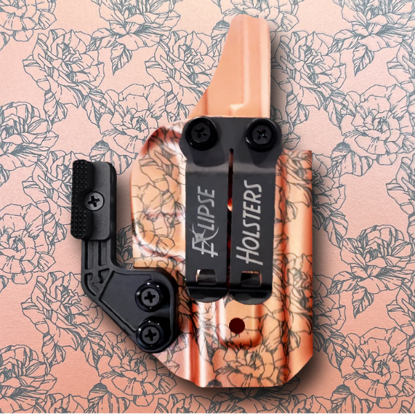 An image showing a stylish inside-the-waistband holster with a rose pattern.