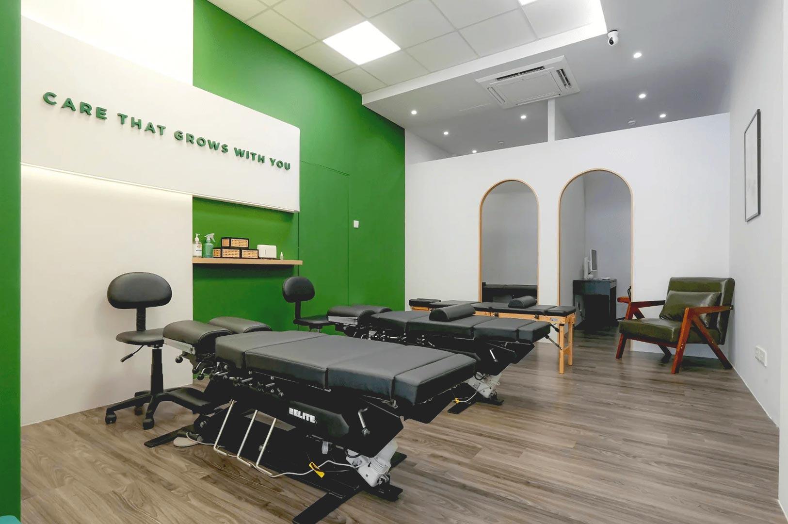 Primary care clinic treatment room in Singapore healthcare facility.