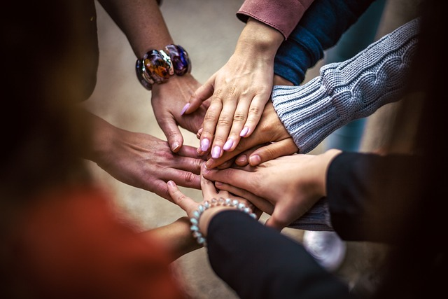 hand touching team, friendship, group psychedelic retreats