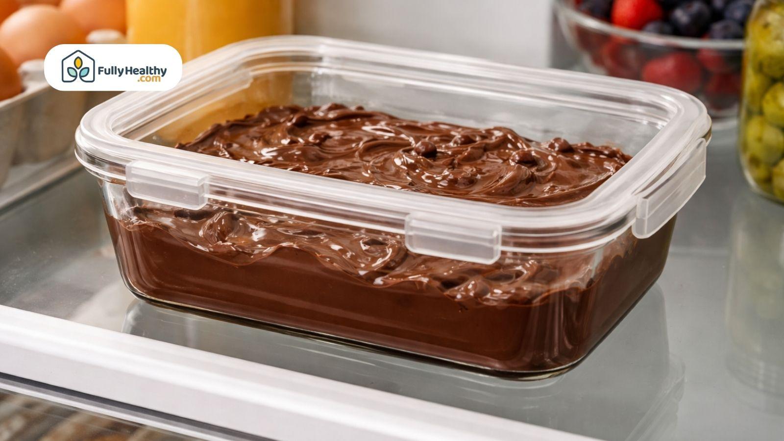 Melted chocolate stored in airtight container inside refrigerator for freshness
