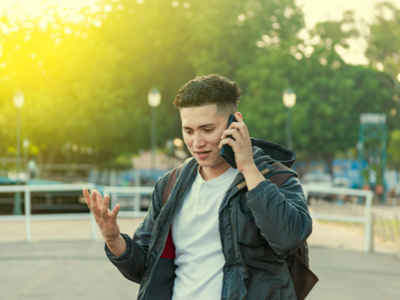 An image showing a person on the phone calling their lawyer after a semi truck accident in Georgia.