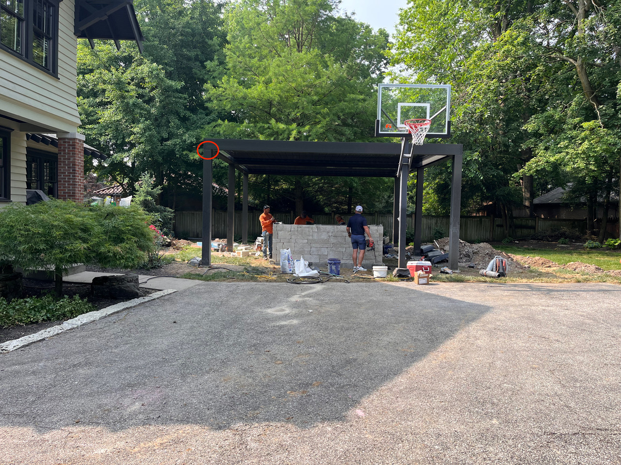 Team of people installing pergola