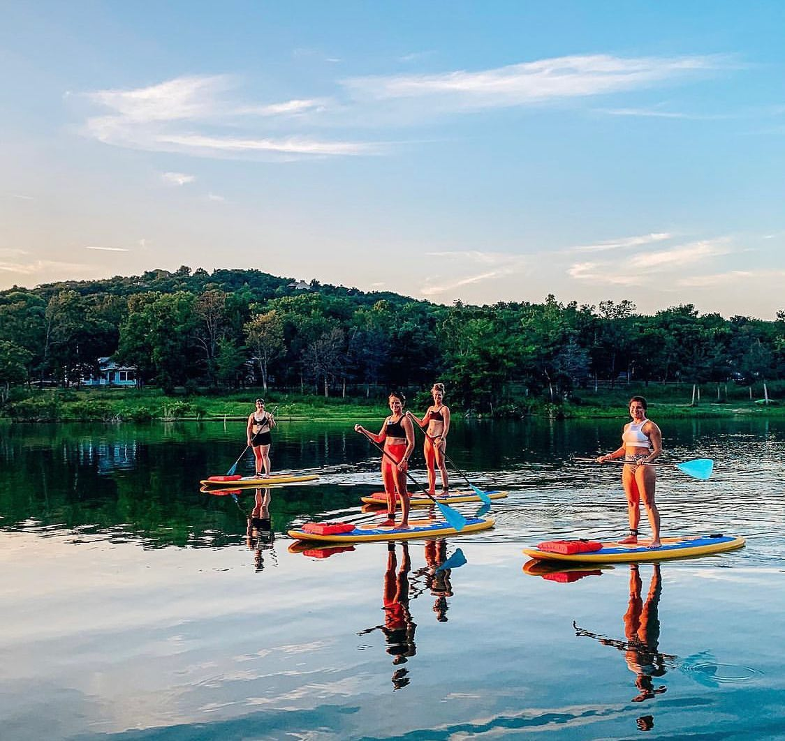 women on paddle boards