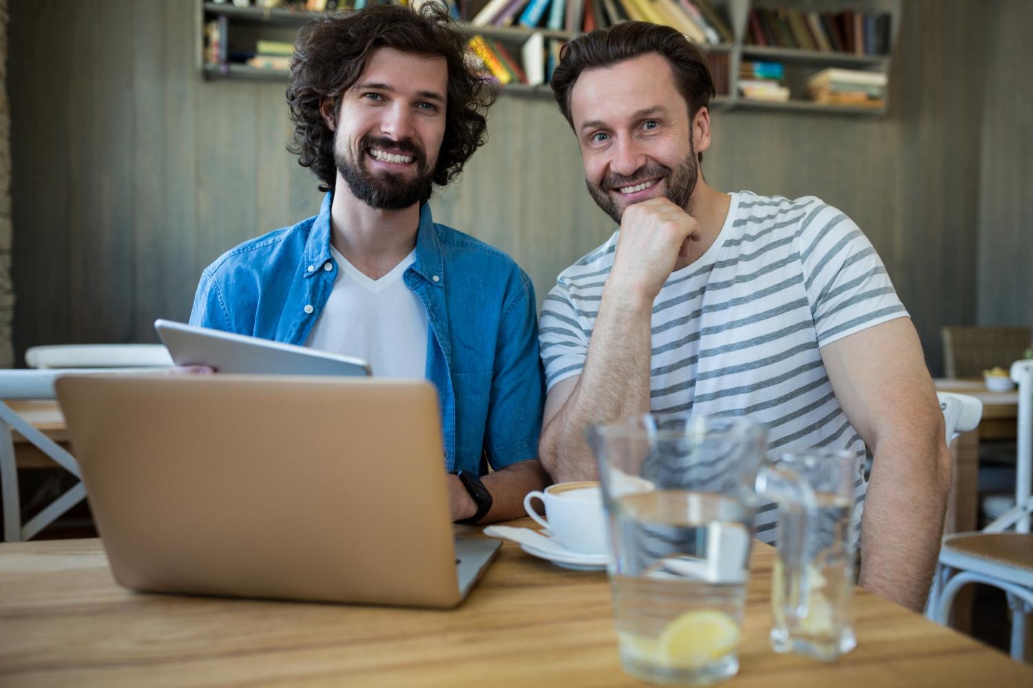 Two men stting up a Wix store to sell products