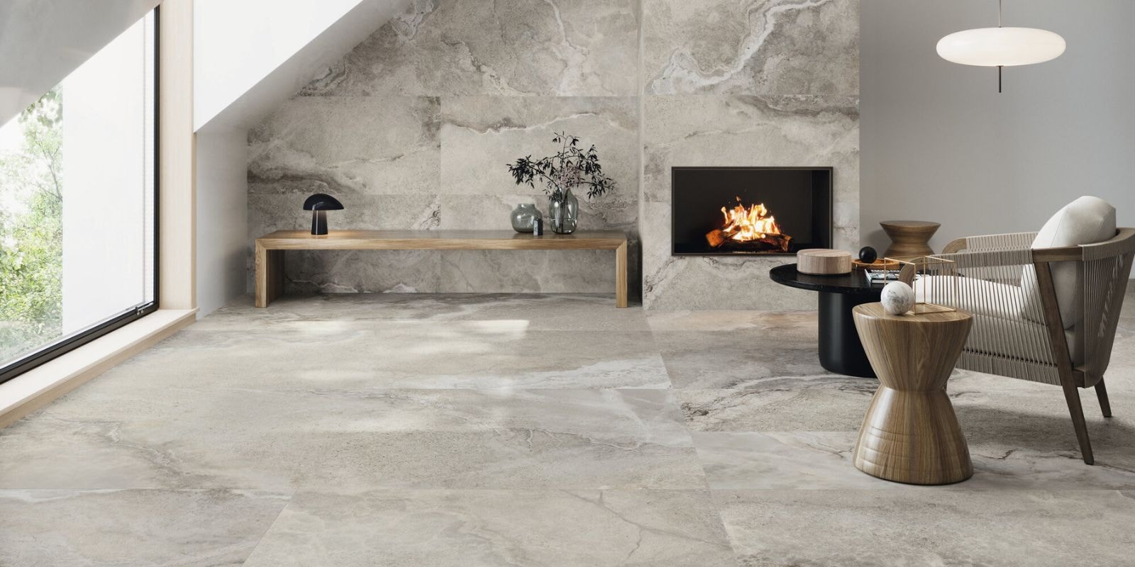 Light grey large format tiles with wooden bench and fireplace.