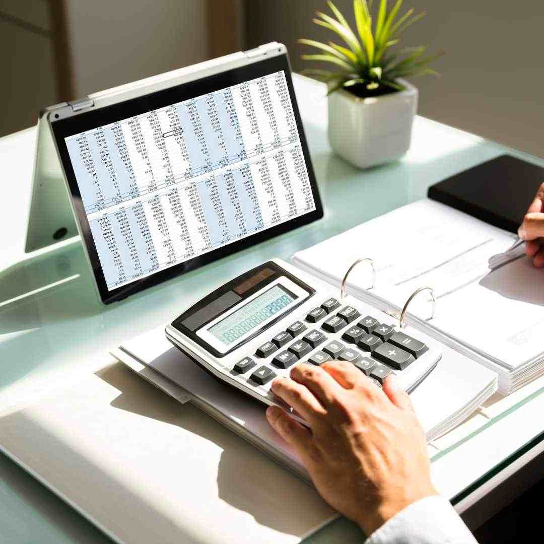 An image showing a calculator and a notepad with the title How to Calculate Monthly Income for accurate income calculations.
