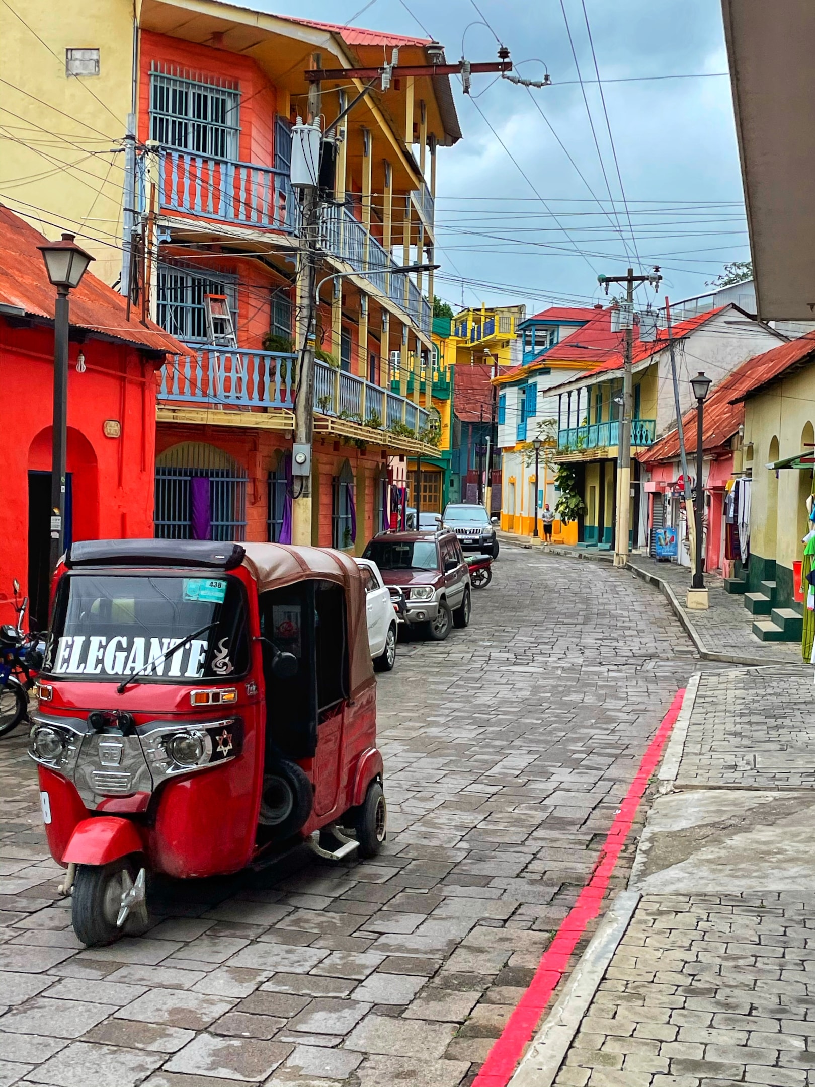 View of the cobblestone street and colorful buildings in Flores Island, Guatemala