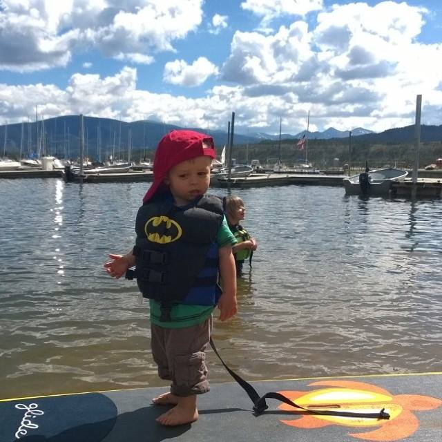 kid on a stand up paddle board