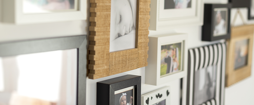You don't need to use matching frames for a gallery wall - this wall uses mismatched frames for a visually interesting display.