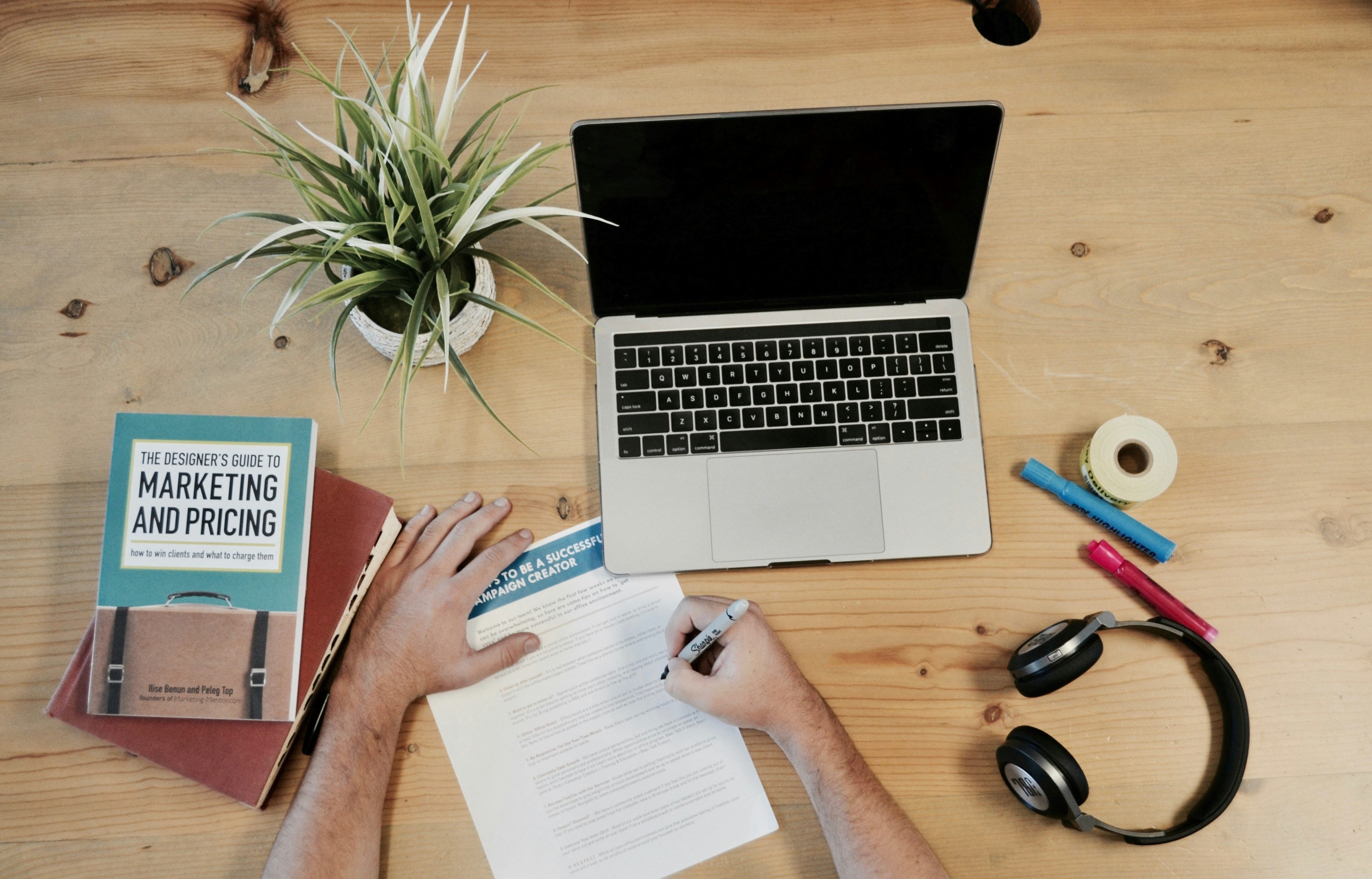 Marketing manager for real estate investment business plans out digital marketing strategies.
