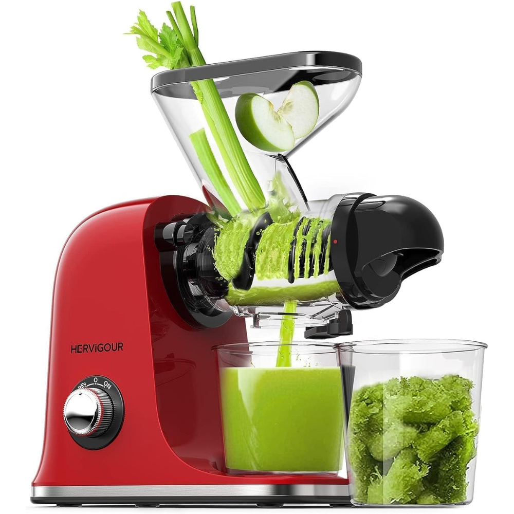 A masticating juicer extracting from celery stalks into juice jug and leftover fruit and vegetable matter