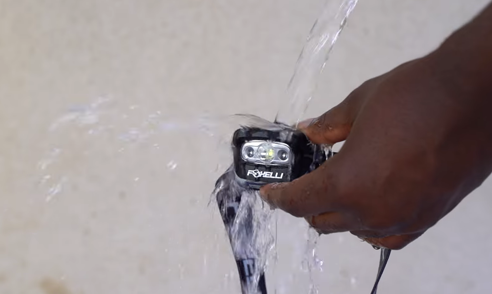 Foxelli MX20B being ran over with a water hose
