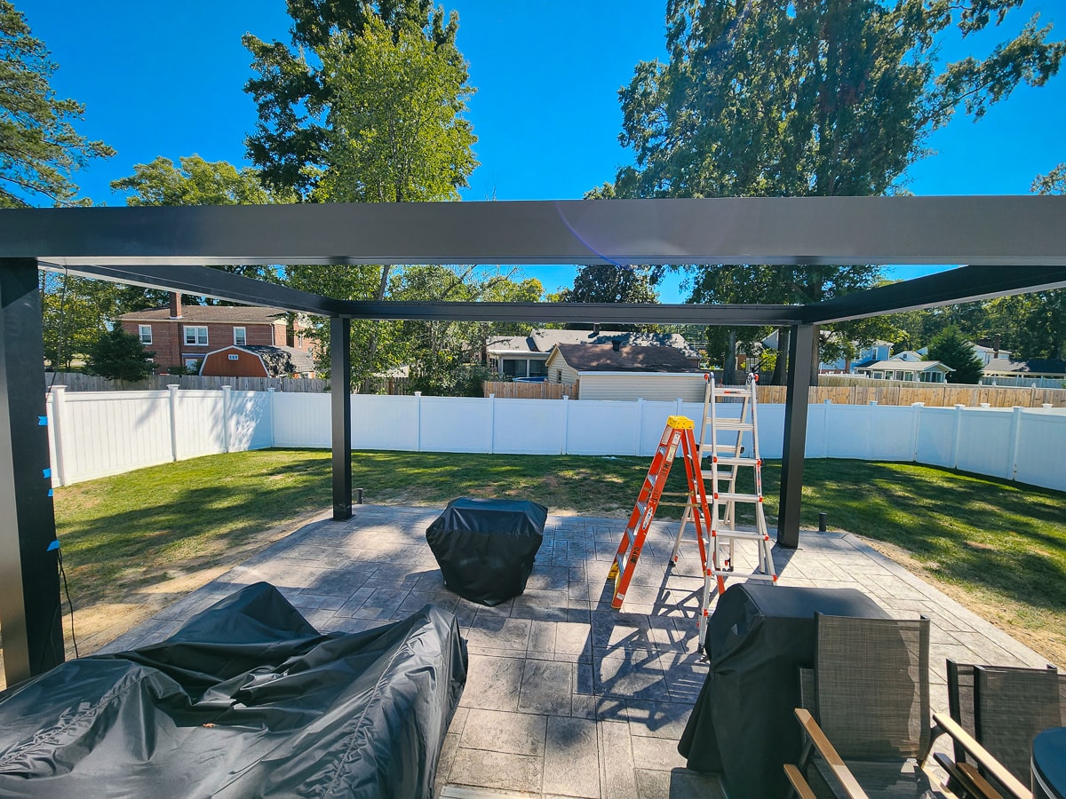 building a pergola near house with Footingpad footings underneath a paver construction at soil grade.