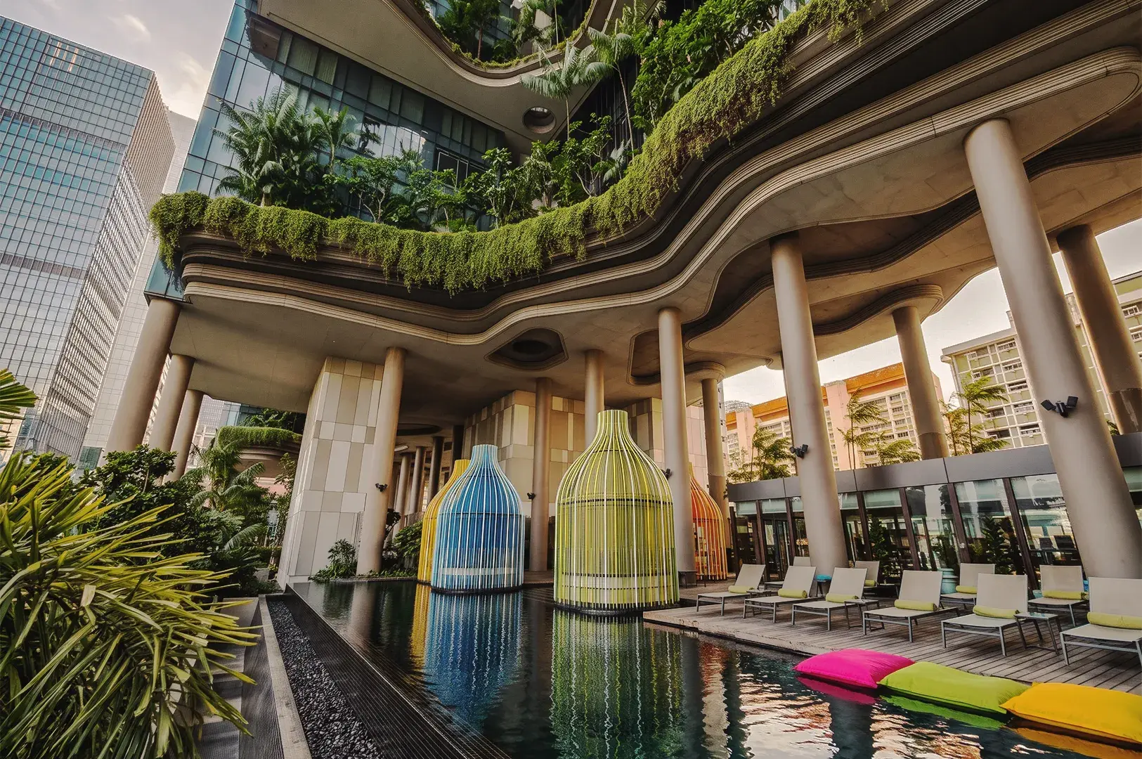 Infinity pool overlooking Marina Bay Sands and Singapore skyline, featuring tropical cocktails and luxury rooftop experience