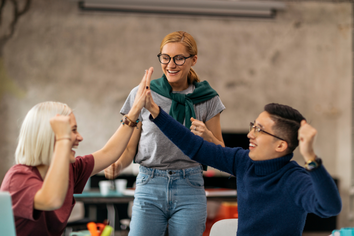 A team celebrating progress in communication.