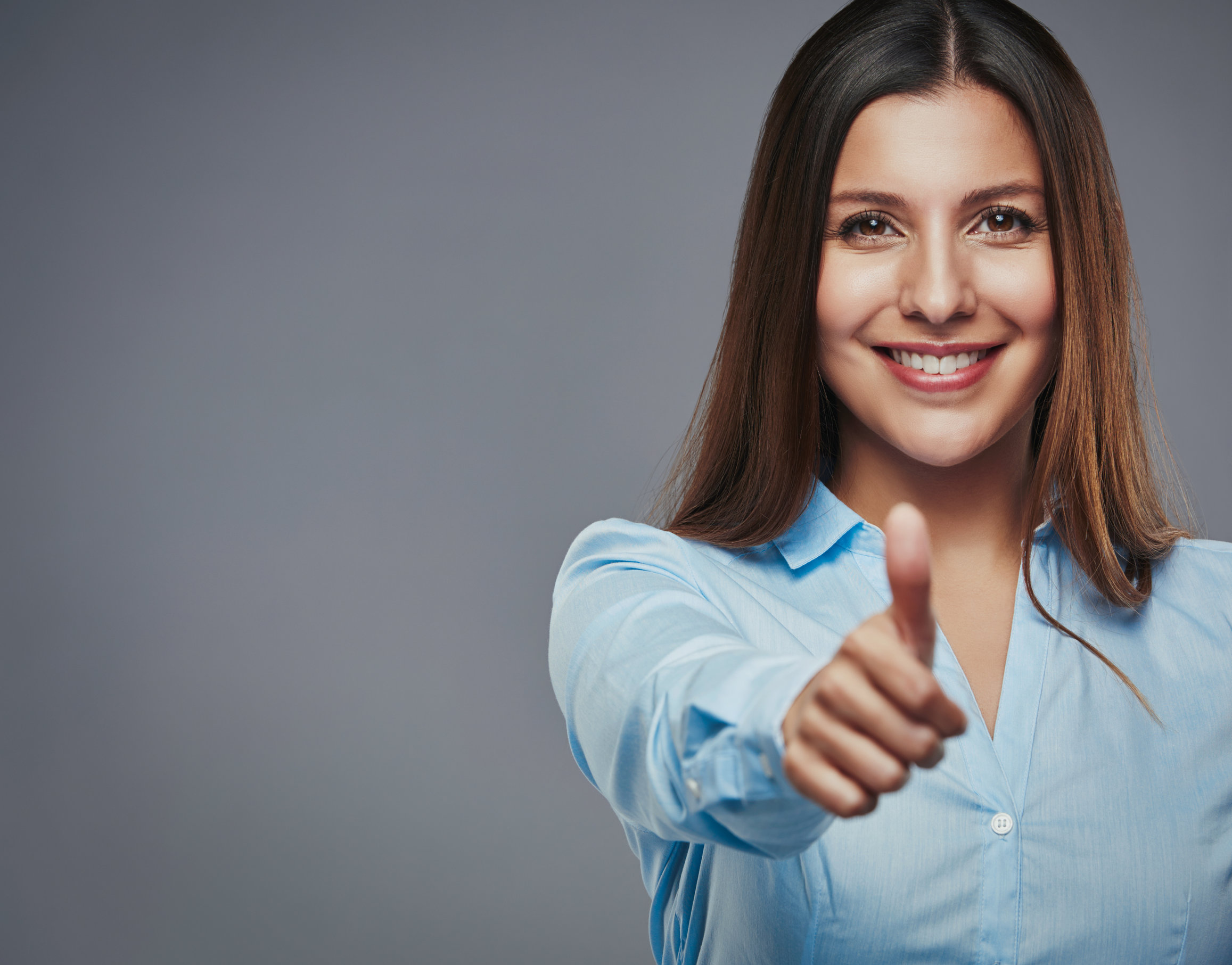 business woman giving thumbs up for business development courses to boost skills and knowledge 