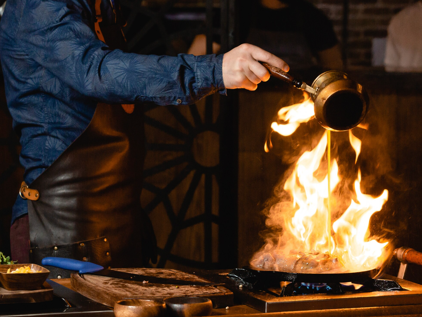 A burning steak on the frying pan