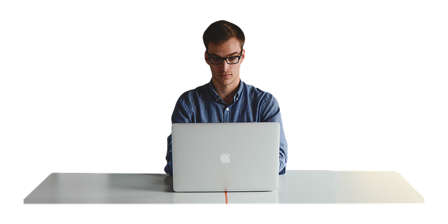 picture of a man using a sitting desk