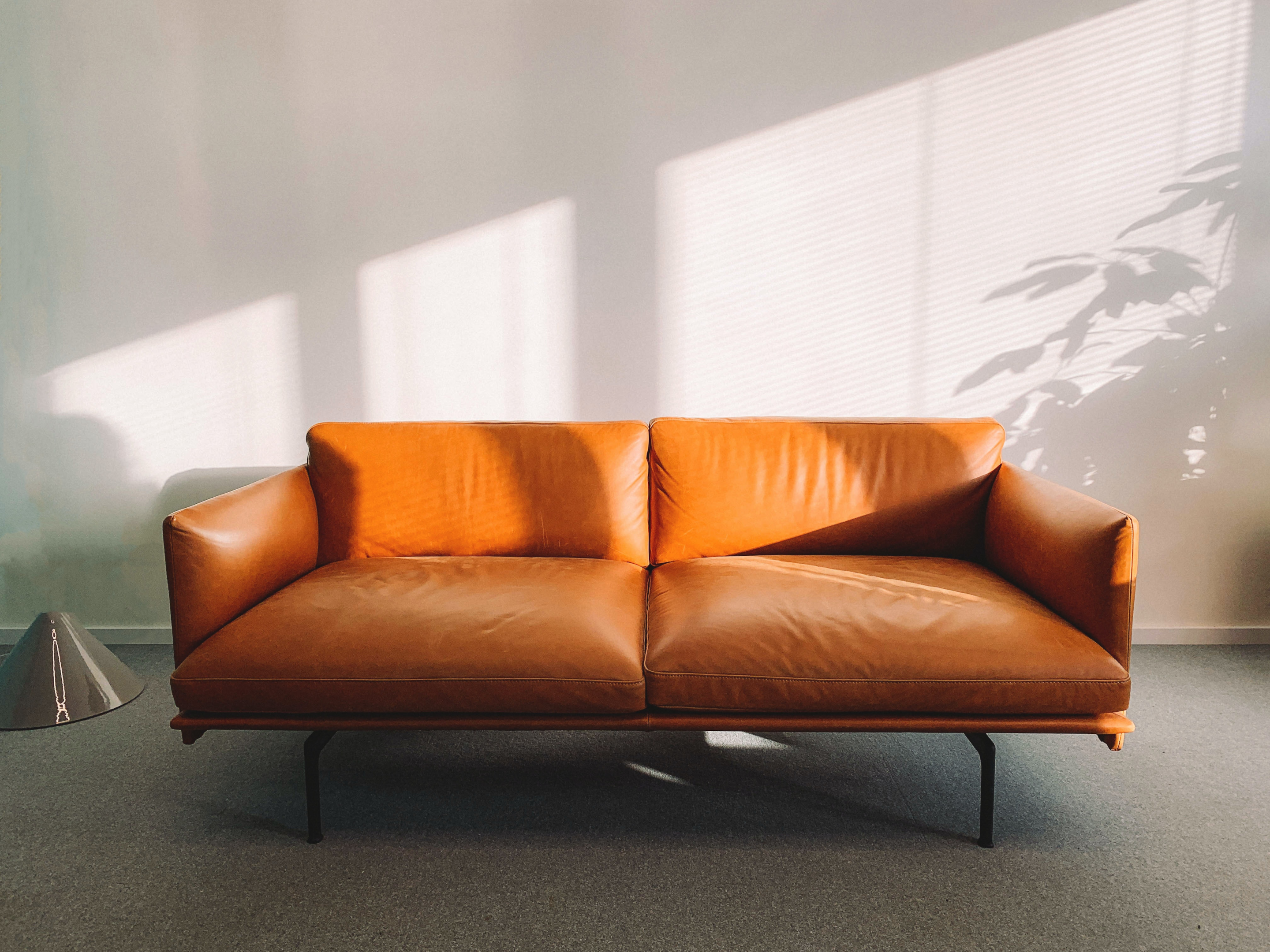 https://www.pexels.com/photo/2-seat-orange-leather-sofa-beside-wall-1866149/