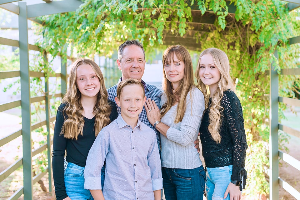 A family posing for their photos session, in Phoenix Arizona.