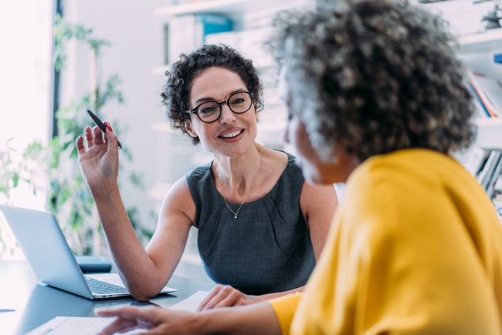 Accountant advising a business owner on national living wage