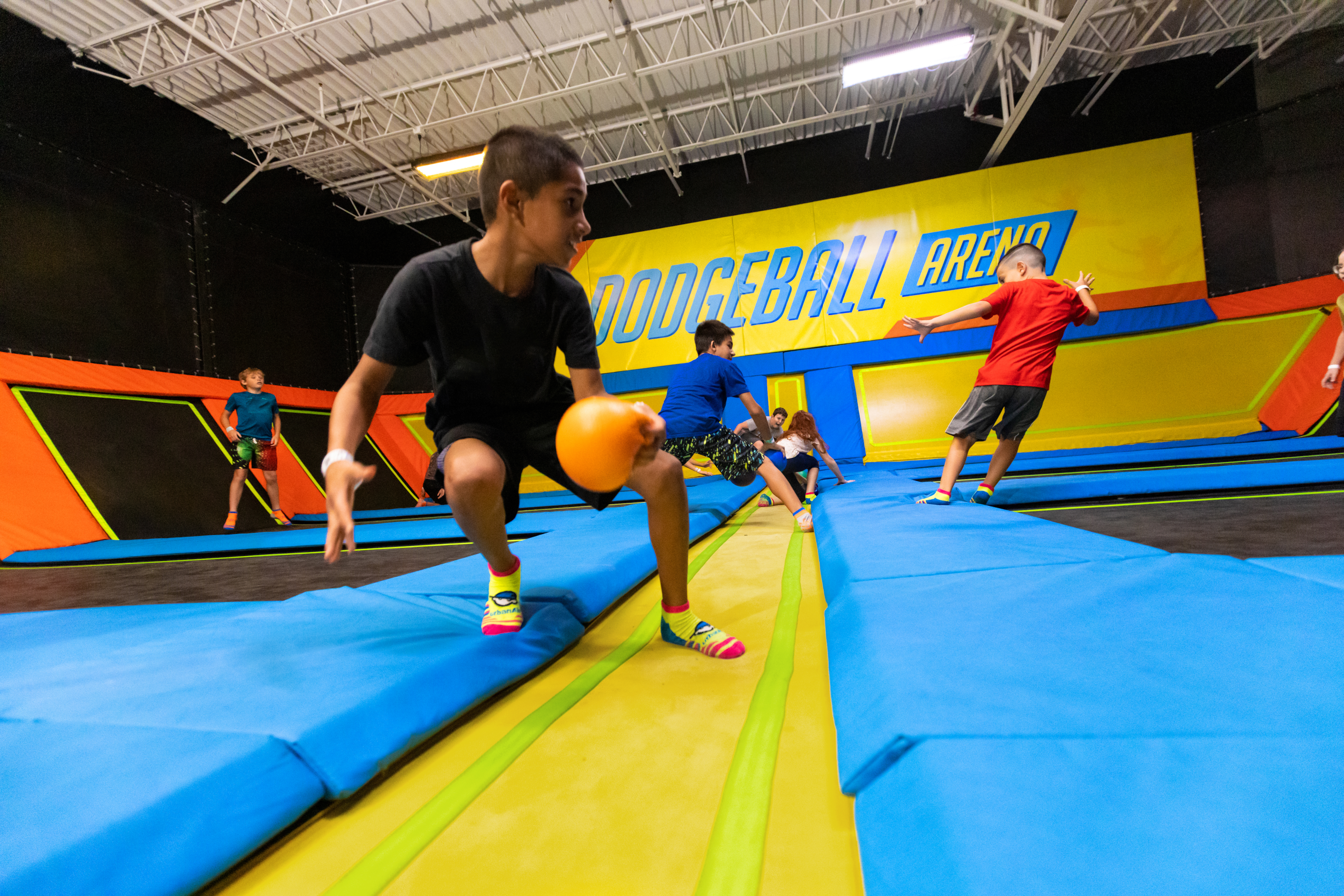 Young boys play dodgeball on the trampolines at Urban Air. 