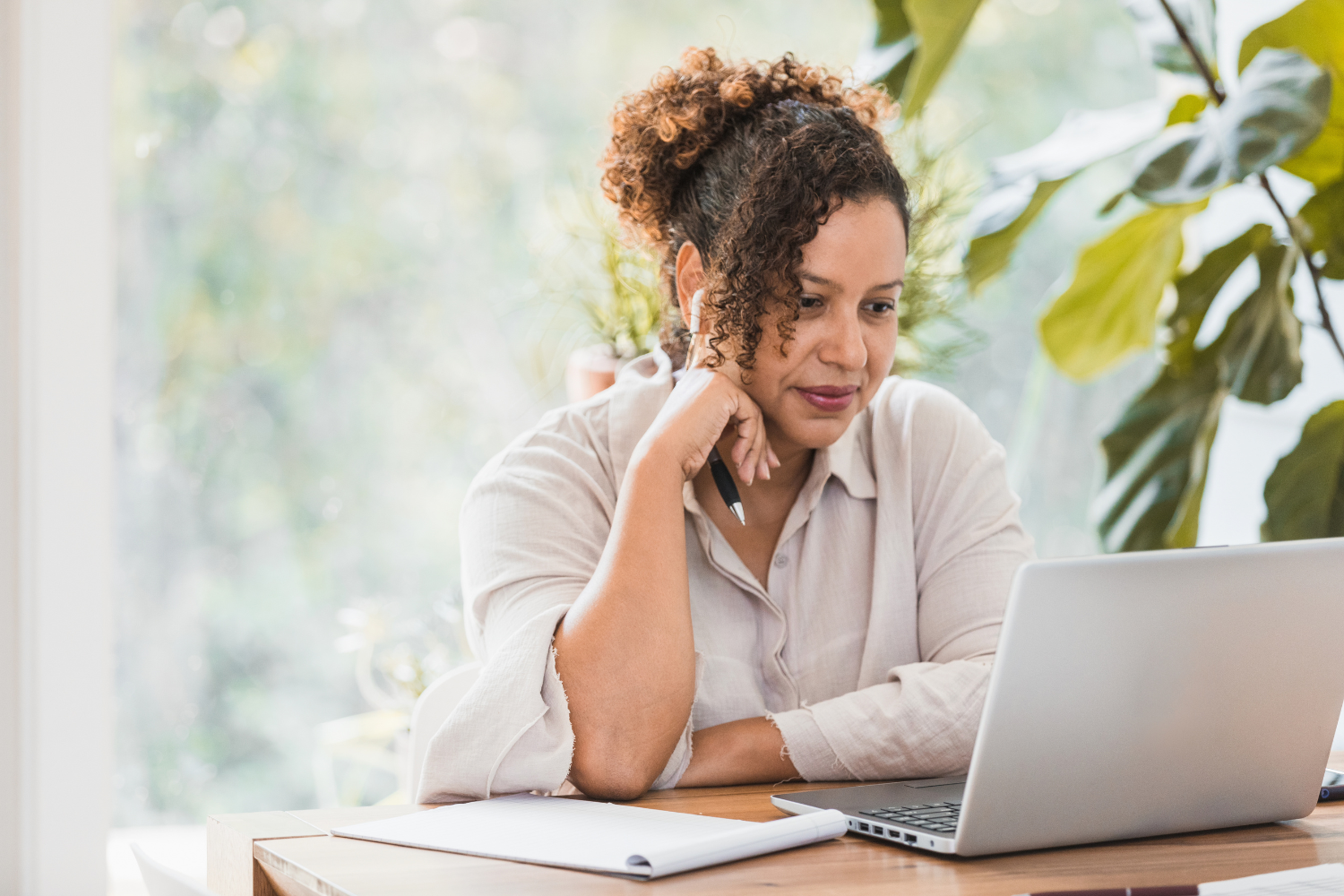 Remote worker looking at laptop.