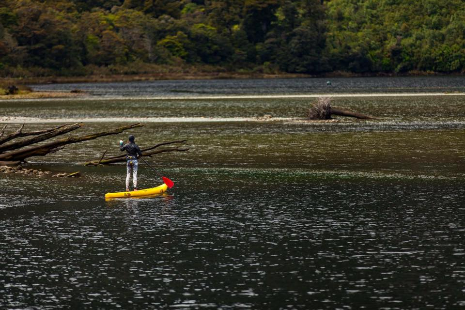 paddle board on an alpine lake