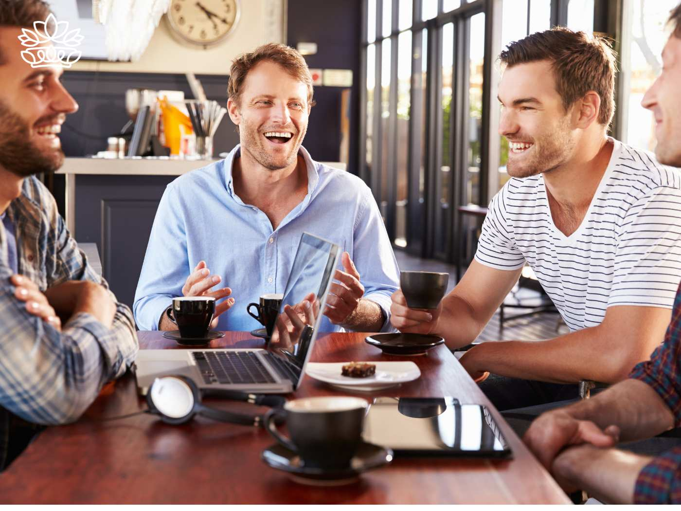 A group of men having a cheerful conversation over coffee, showcasing the Gift Boxes for Men Collection - One size fits all, perfect for any occasion, including items like a box and beer glass - Fabulous Flowers and Gifts
