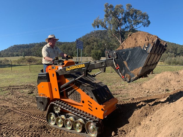 skid steer size with  rated operating capacity & operating weight in tight corners