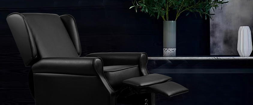 An Artiss Black PU Leather recliner, in a laid back position, set in a dark room with a single white marble shelf holding two vases.