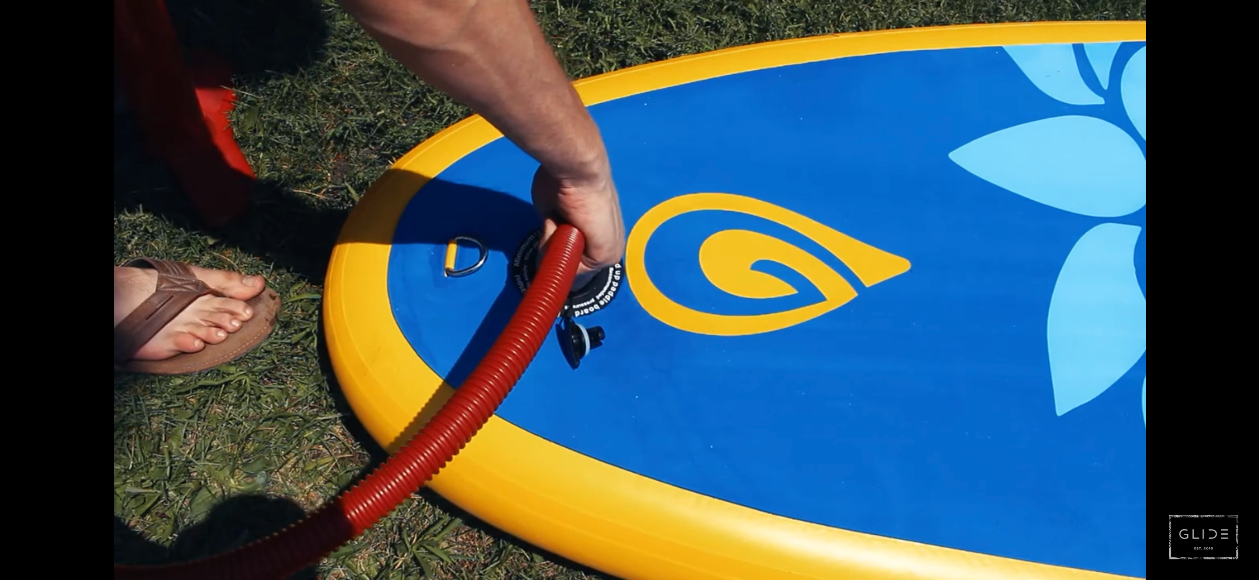 inflatable paddle board with psi gauge in upright position 