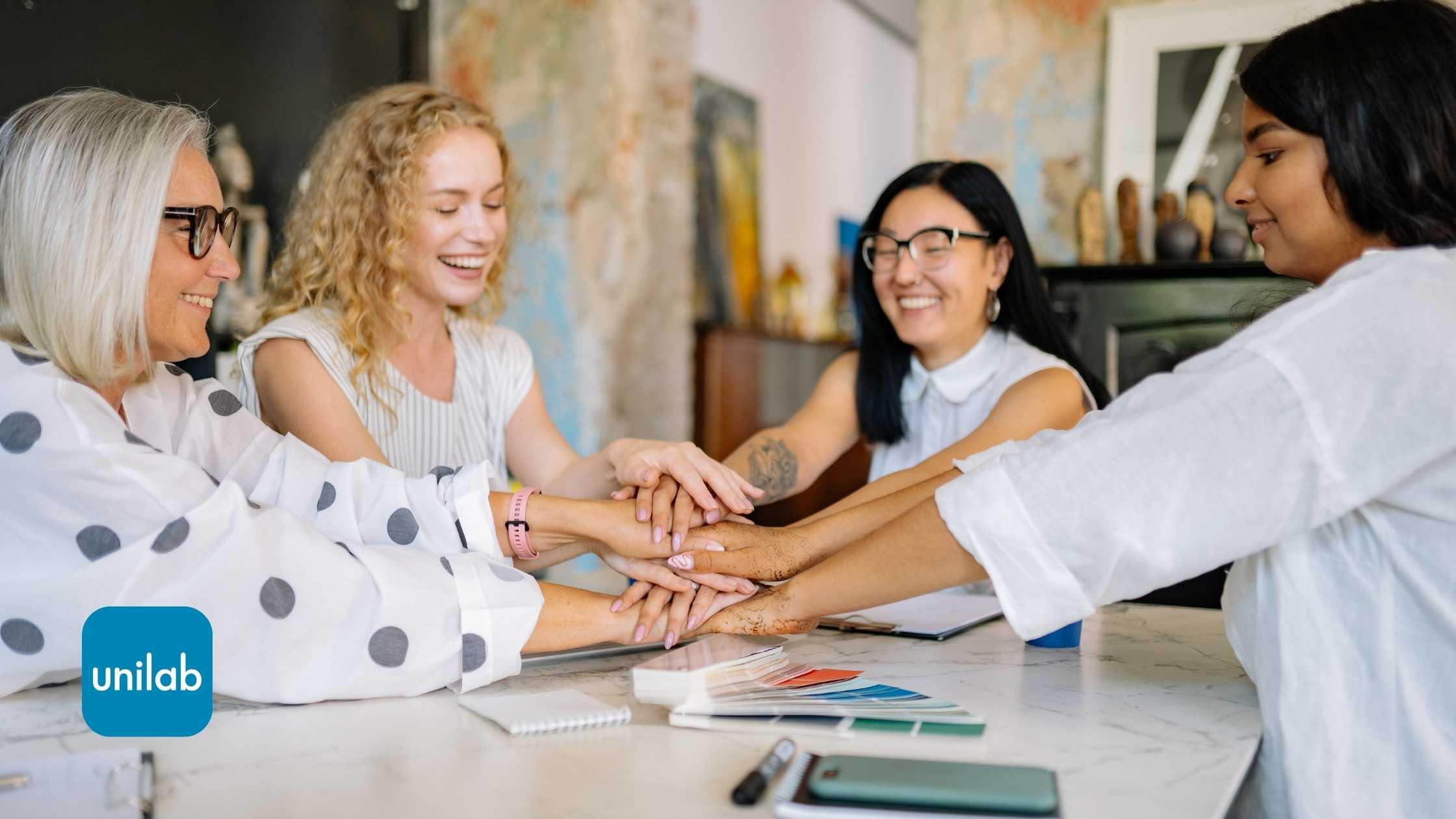 Women together, happy and having a conversation around a table