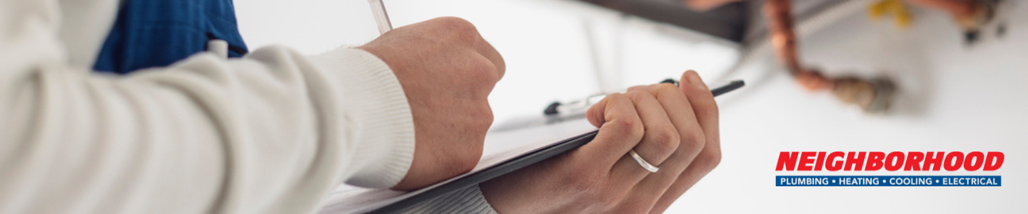 A professional HVAC contractor diagnosing a buzzing furnace and furnace noises on a heating system.